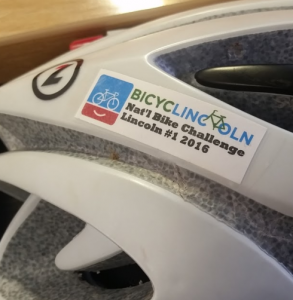 Get your helmet sticker at Commuter Club or other cycling events around town.